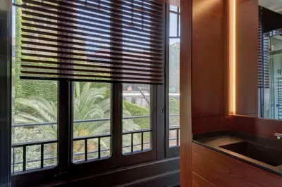 a window with a view of a palm tree at SuiteaBcn II in Barcelona