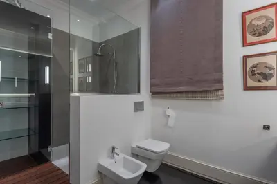 a bathroom with a toilet and a sink at SuiteaBcn II in Barcelona