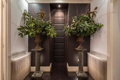 two vases with plants in them in a hallway at SuiteaBcn II in Barcelona