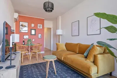 a living room with a couch and a table at Habitat Apartments Plaza España Urban in Barcelona