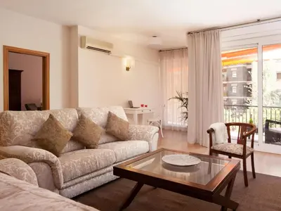 a living room with a couch and a table at Click&Flat Luxury mistral in Barcelona