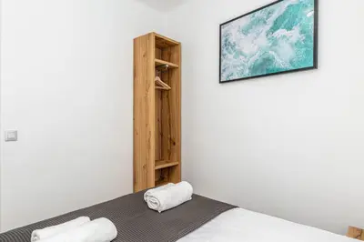 a room with a bed and a picture on the wall at Poble Sec 3BR 2BA Balcony Sleeps 7 in Barcelona