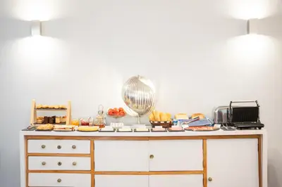 a table with food on top of it at We Boutique Hotel Barcelona in Barcelona