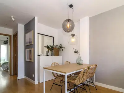 a dining room with a table and chairs at Sitges Spaces Terrace Apartment- 1 Bedroom, 1Bathroom, Huge Terrace in Sitges