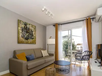 a living room with a couch and a table at Sitges Spaces Terrace Apartment- 1 Bedroom, 1Bathroom, Huge Terrace in Sitges