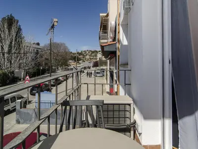 a balcony of a building with a view of a street at Sitges Spaces Terrace Apartment- 1 Bedroom, 1Bathroom, Huge Terrace in Sitges