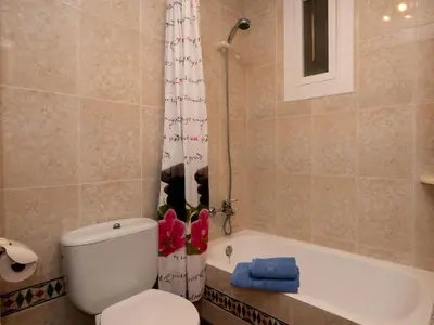 a bathroom with a toilet and a tub and a shower at Apartment Sun and Beach by Interhome in Cunit