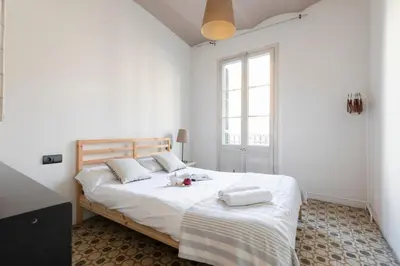 a bedroom with a bed with two towels on it at 1814 - AB Sagrada Família Cartagena in Barcelona