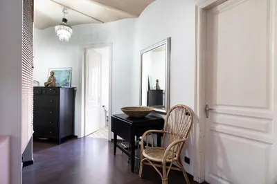 a room with a desk and a mirror and a chair at 1814 - AB Sagrada Família Cartagena in Barcelona
