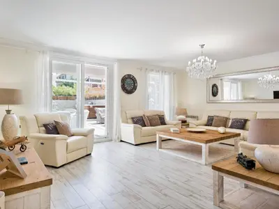a living room with couches and a table at Sitges Spaces Mediterranean Apartments 5 Bedrooms, 4 Bathrooms, 75M2 Terrace, Centre Sitges- Sleeps 11 in Sitges