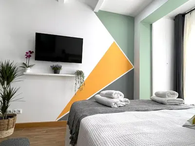 a bedroom with a bed with towels on it at Barcelona COZY Apartment in Hospitalet de Llobregat