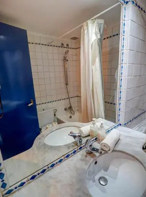 a bathroom with a sink and a tub and a shower at Barco Attic by Hello Homes Sitges in Sitges