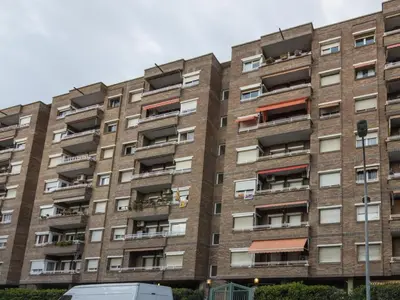 an apartment building with balconies on the side of it at Click&Flat Xoriguer in Barcelona
