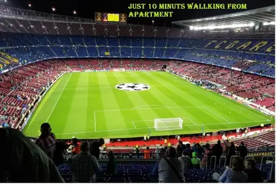 a crowd of people in a stadium watching a soccer game at Àtico lumineux à 10 min du centre ville in Hospitalet de Llobregat