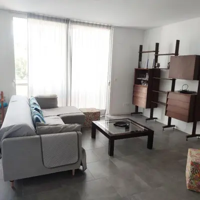 a living room with a couch and a coffee table at Apartment with a view close to the beach in Badalona