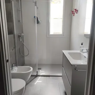 a bathroom with a sink and a toilet and a shower at Apartment with a view close to the beach in Badalona