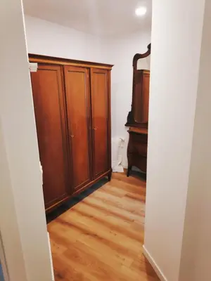 a hallway with wooden cabinets and a wooden floor at Apartment with a view close to the beach in Badalona