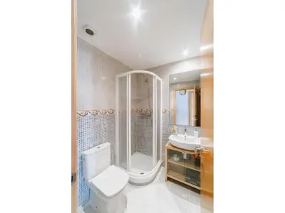 a bathroom with a toilet and a shower and a sink at Sitges Spaces Deluxe Beach Apartment- 3 Bedroom, 2 Bathroom, Next to Beach, Sleeps 6 in Sitges