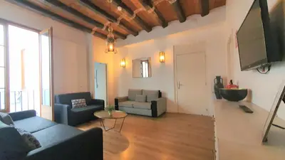 a living room with two couches and a tv at Barrio Gotico Apartments Ferran in Barcelona