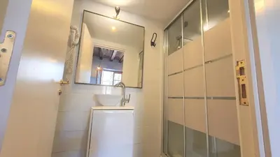 a bathroom with a sink and a mirror at Barrio Gotico Apartments Ferran in Barcelona