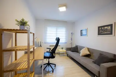 a living room with a couch and a table at Stay U-nique Villa Portimar in Arenys de Mar