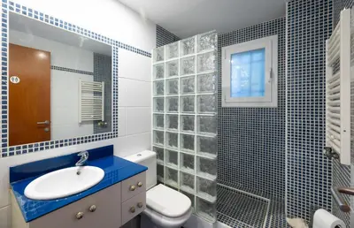 a bathroom with a sink and a toilet and a shower at Stay U-nique Villa Portimar in Arenys de Mar