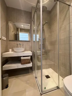 a bathroom with a shower and a sink at Bio Resort Mediterráneo in San Martín Sarroca