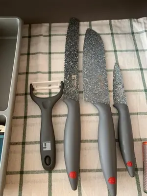 a group of knives sitting on top of a table at APARTAMENTO construcción nueva BARCELONA - CALELLA in Calella