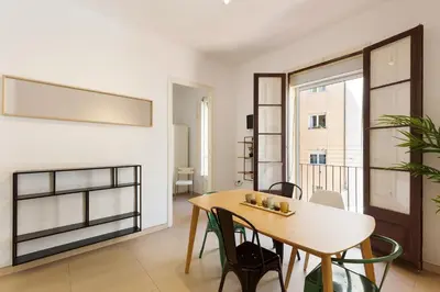 a dining room with a table and chairs at Stay U-nique Apartments Mistral in Barcelona