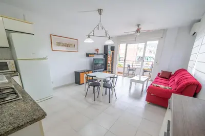 a bathroom with a toilet and a sink and a mirror at HomeHolidaysRentals Margot - Costa Barcelona in Pineda de Mar