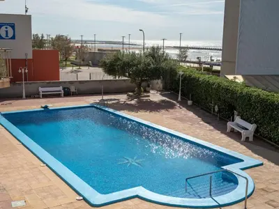 a large blue swimming pool on top of a building at Apartment Blue Sea by Interhome in Cunit