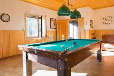 a billiard room with a pool table in it at El Chalet del Montseny in Seva