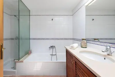 a bathroom with a tub and a sink and a shower at Mediterranean villa with pool near barcelona in Cabrera de Mar