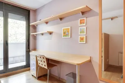 a home office with a desk and shelves at Stay U-nique Apartments Diagonal Mar in Barcelona