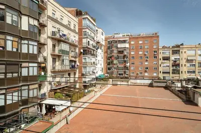 an empty parking lot in a city with buildings at Stay U-nique Apartments Hospital Clinic in Barcelona