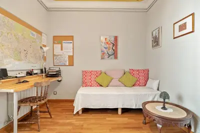 a room with a bed and a desk with a desk at Stay U-nique Apartments Hospital Clinic in Barcelona