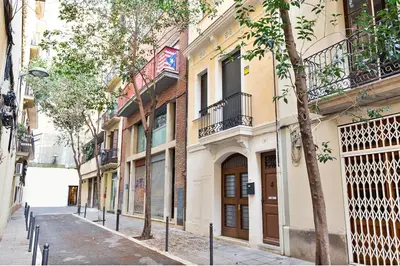 an empty street in a city with buildings at Stay U-nique Apartments Terrassa in Barcelona