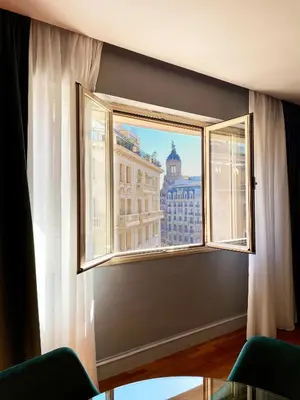 a window with a view of a building at Stay U-nique Apartments Passeig de Gracia II in Barcelona