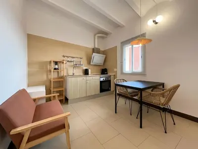 a kitchen and dining room with a table and chairs at Stay U-nique Apartments Pasteur in Barcelona