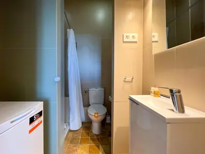 a small bathroom with a toilet and a sink at Stay U-nique Apartments Pasteur in Barcelona