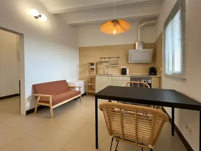 a kitchen and dining room with a table and chairs at Stay U-nique Apartments Pasteur in Barcelona