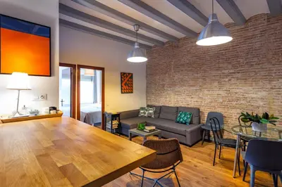 a living room with a couch and a table at Stay U-nique Apartments Parlament in Barcelona