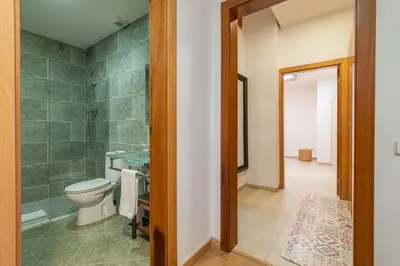 a bathroom with a toilet and a walk in shower at Stay U-nique Apartments Passatge de Font in Barcelona