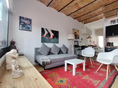 a living room with a couch and a table at Stay U-nique Apartments Sagues in Barcelona