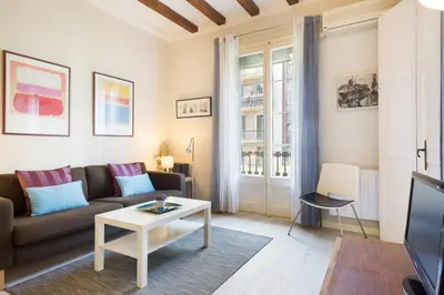 a living room with a couch and a table at Stay U-nique Apartments Manso in Barcelona