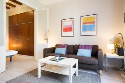 a living room with a couch and a table at Stay U-nique Apartments Manso in Barcelona