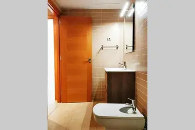 a bathroom with a toilet and a sink at Mazi Apartments Terrace in Mataró
