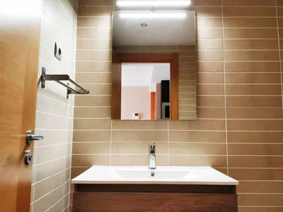 a bathroom with a sink and a mirror at Mazi Apartments Terrace in Mataró