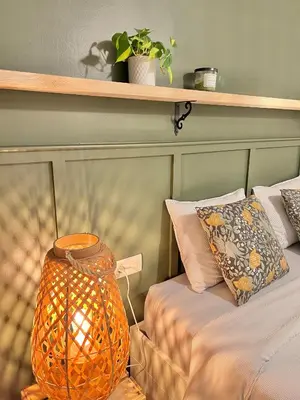 a bedroom with two beds and a vase on a table at Charming appartement in the heart of Barcelona in Barcelona