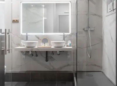 a bathroom with a sink and a shower at La Maison de Barcelone in Barcelona